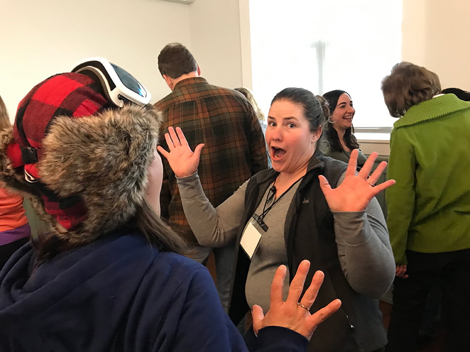 Lady with hands up and excited look in a group training